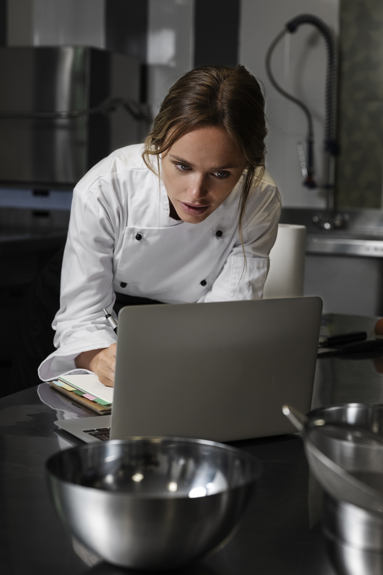 Chef teaching an online class in a calm editorial kitchen